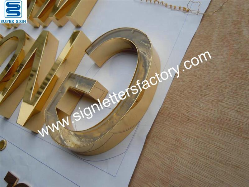 polished brass letter sign